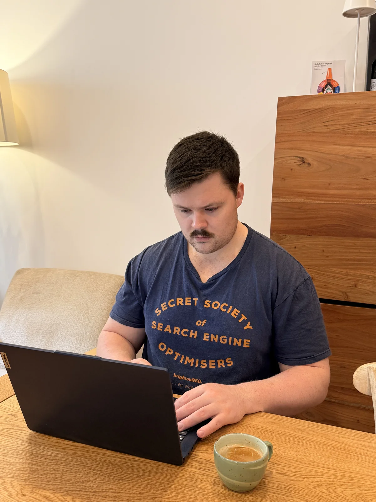 Charlie Johns working at a desk in Cork